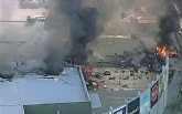 Destroços da aeronave (Foto: Reprodução/Canal 9/via AP Photo)